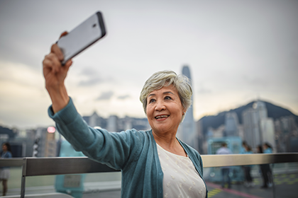 Older woman taking a selfie