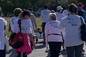 Guests in watching white t-shirts participating in an outdoor Dementia Society event.
