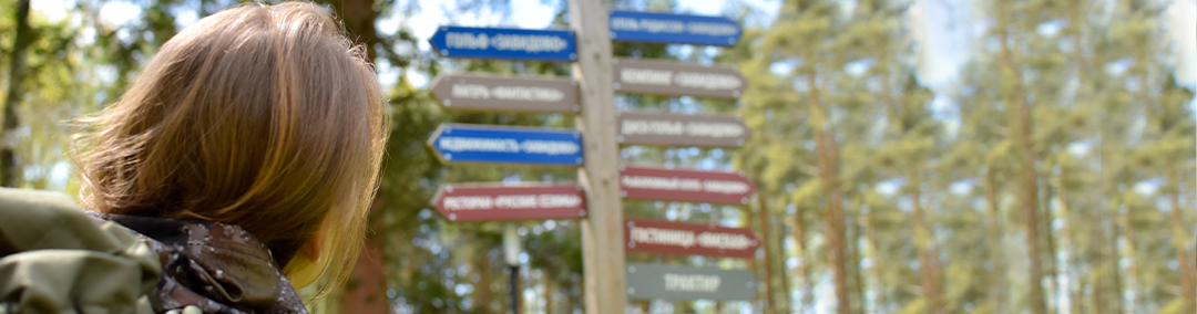 Woman with wayfinding signs